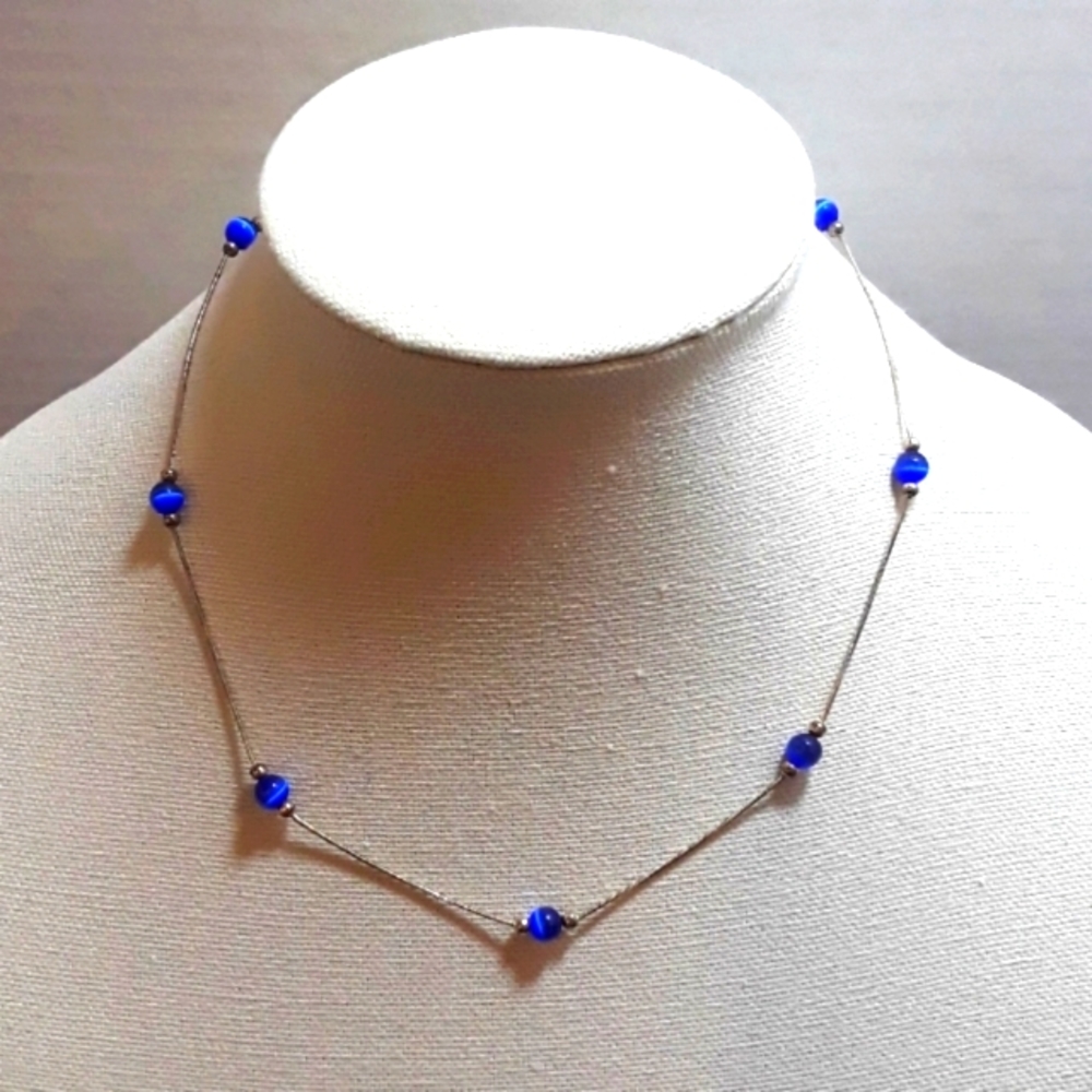 Cat's eye beads and silver necklace
